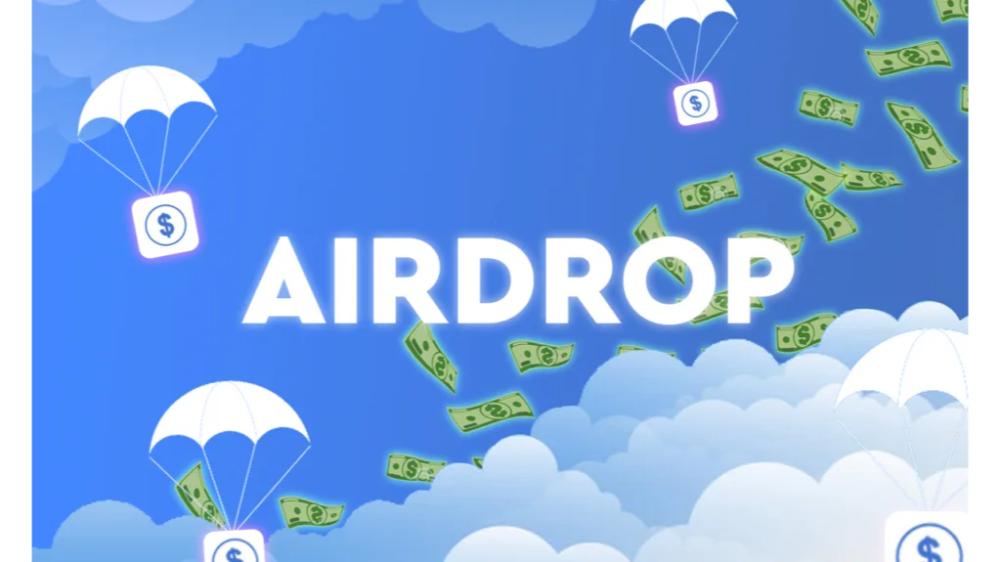 کلمه Airdrop در آسمان آبی و ابری همراه با چند دلار که به چتر وصل هستند.
