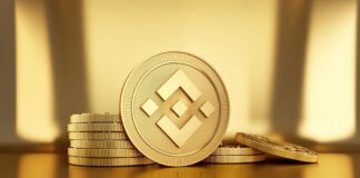 استخراج بایننس کوین با گوشی چند کوین بایننس در روی در میزی طلایی رنگ