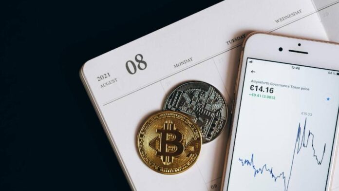 two bitcoins, a calendar and a mobile phone (2)