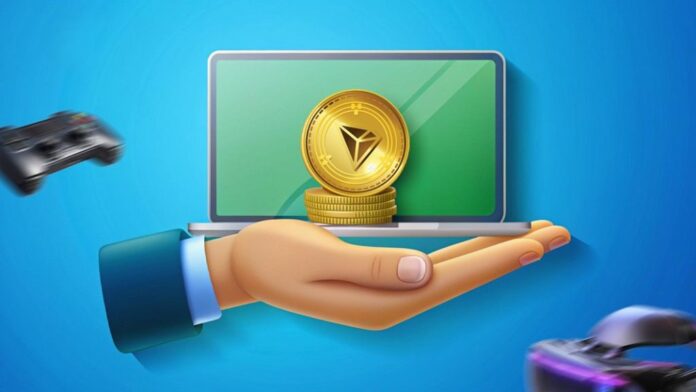 بازیهای ارز دیجیتال ترون لپتاپ و یک دست